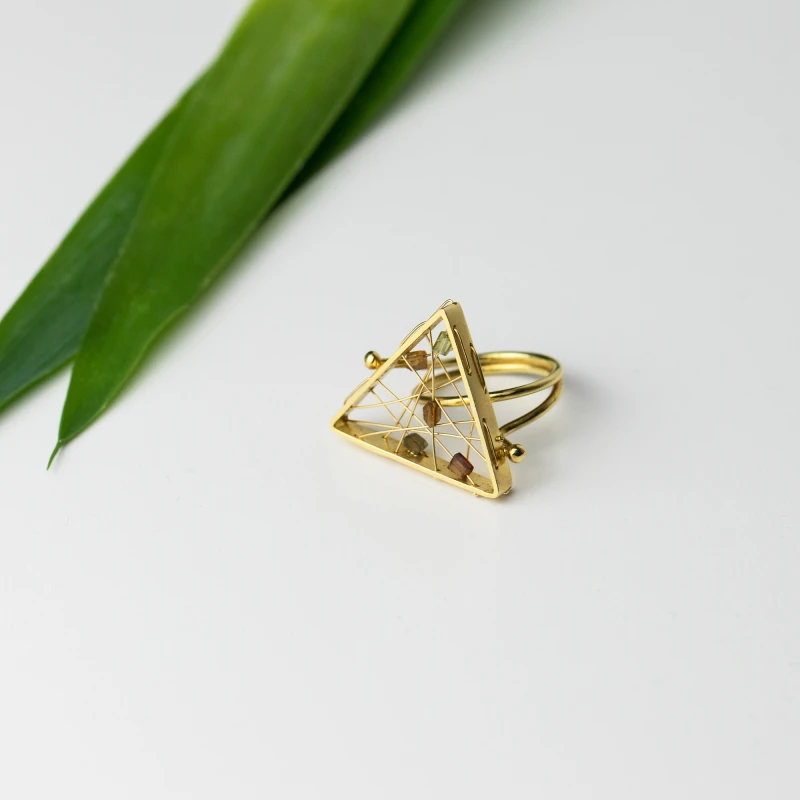 Τriangular-shaped gold ring with 5 tourmalines in brownish colours (gemstones) woven into impressively thin gold webs