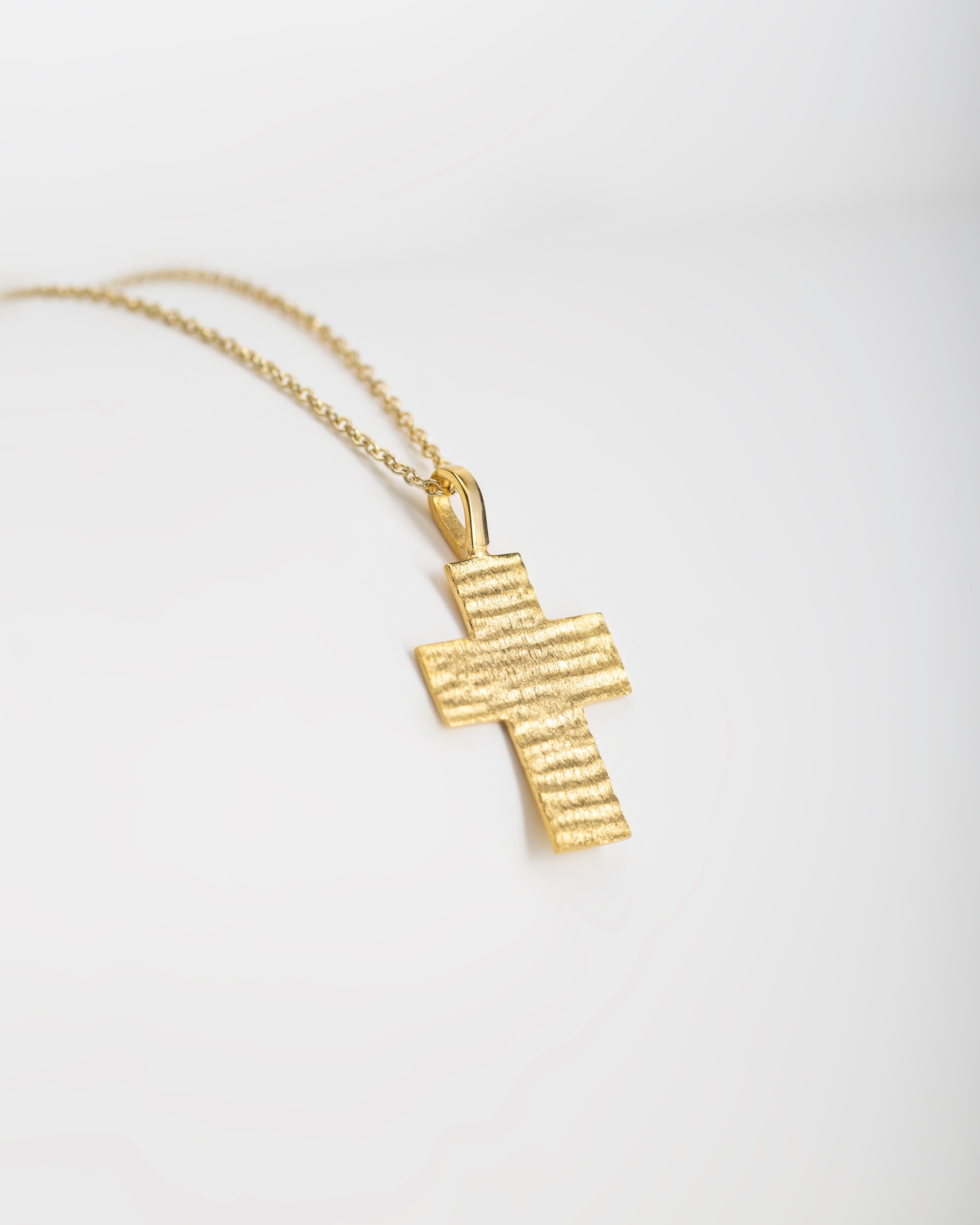 Slim gold cross